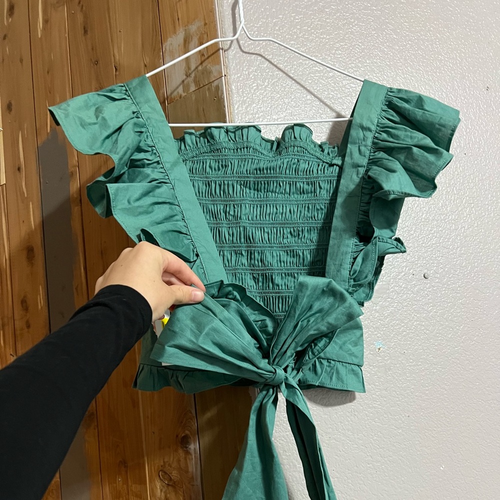 Green ruffled sleeved blouse